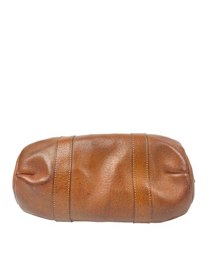 null HERMES
Model created in 1924
Small cylindrical travel bag in brown leather,...