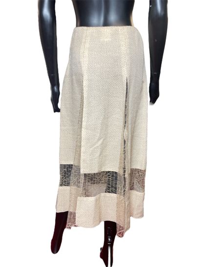 null CHANEL 
Long skirt in beige embossed silk and linen, with transparent cuts 
T...