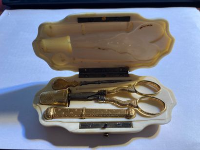null SEWING KIT
In yellow gold including a thimble, a pair of scissors, a pick, a...