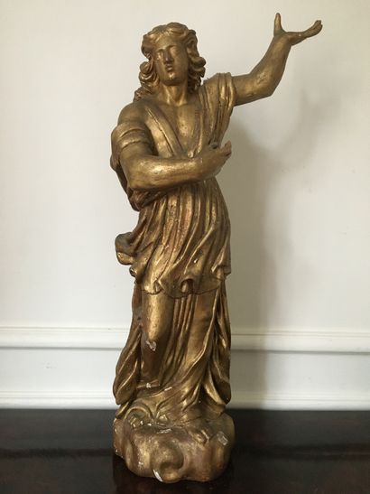 Angel in wood carved in the round and gilded....