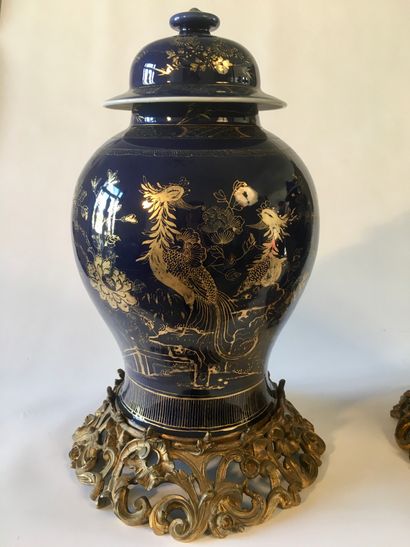null CHINA 
Pair of lapis blue covered baluster potiches, decorated with gold and...