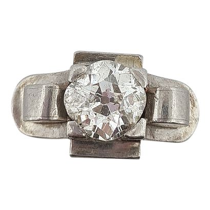 null RING 
holding an old cut diamond of about 1.25 carat. The setting with geometric...