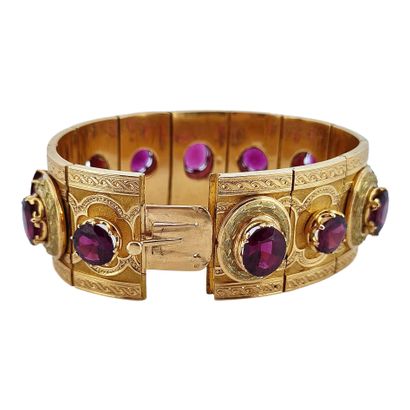 null BRACELET 
holding a succession of almandine garnets in a plant decoration. Mounting...