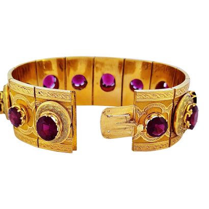 null BRACELET 
holding a succession of almandine garnets in a plant decoration. Mounting...