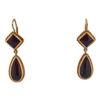 null PAIR OF EARRINGS
holding a square with a drop paved with almandine garnets....