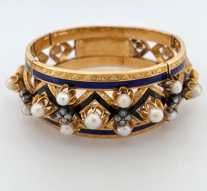 null BRACELET
with blue and black enamelled geometric decoration, punctuated with...