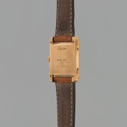 null CARTIER
Tank 
Ref : 1151.
N° : CC118978
Circa : 1990.
Yellow gold bracelet watch...