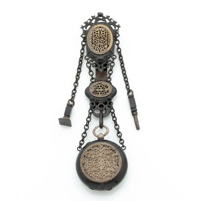 null MOURNING WATCH
About : 1880. 
Mourning watch, blackened metal chatelaine and...