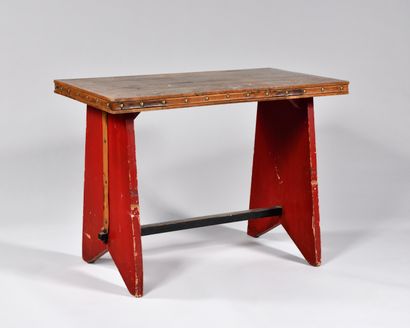 null WORK OF THE 1940S
Rectangular table with oak veneer top, the belt centered with...
