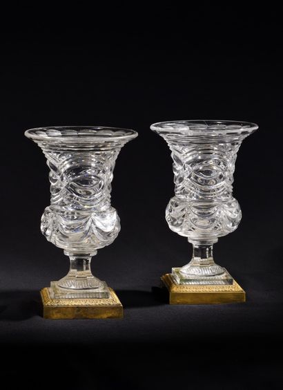 null PAIR OF CRYSTAL VASES
with cut sides of baluster form on pedestal. Base of square...