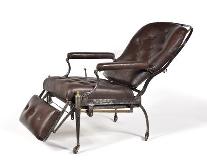 null ARMCHAIR WITH MECHANISM IN METAL COVERED WITH LEATHER. 
It rests on four feet...