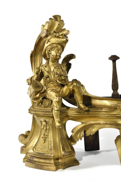 null PAIR OF ANDIRONS
in gilt bronze decorated with young children musicians and...