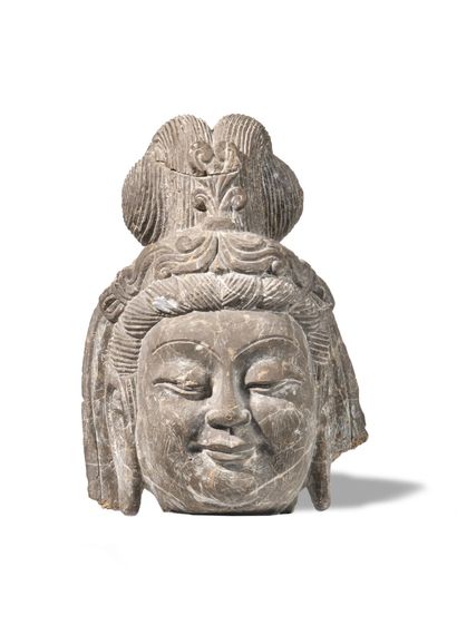 HEAD OF BUDDHA IN CARVED STONE. 
Work of...