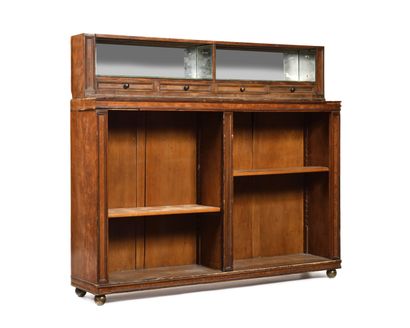 null PAIR OF BOOKCASES
in wood and mahogany veneer.
The lower part is composed of...