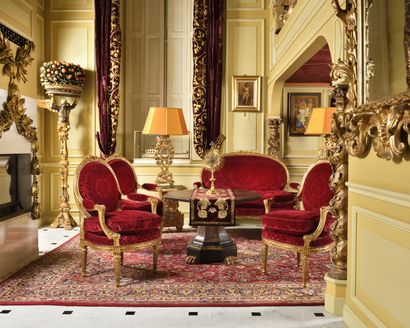 null Carved, molded and gilded wood SALON comprising a large sofa and six armchairs....