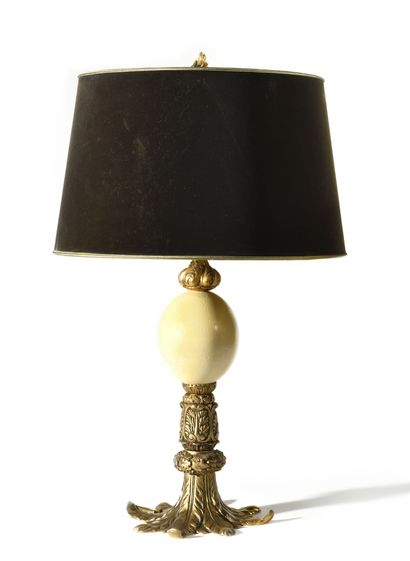 DESKTOP LAMP composed of carved elements...