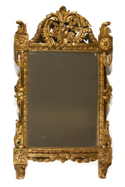 MIRROR 
in gilded wood, decorated with openwork...