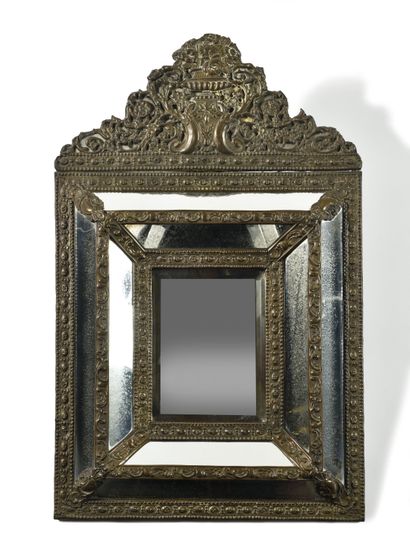 null MIRROR with pare-closes
in chased and repoussé silver with floral bouquets on...