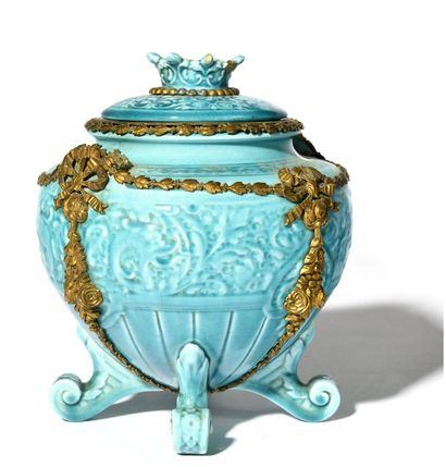 null COVERED POT

Covered pot in turquoise earthenware, decorated with garlands of...