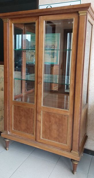 null RINCK HOUSE 

Varnished mahogany showcase with two glass doors and pilaster...