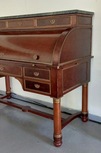 null CYLINDER DESK in mahogany veneer, handles and locks in brass, four columns base...