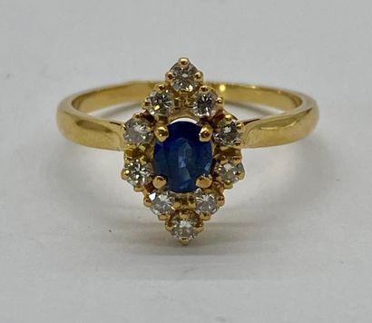 null RING 

in the shape of a shuttle holding an oval sapphire in a circle of brilliant-cut...