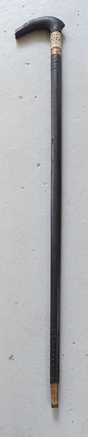 null SYSTEM CANE 

Sword cane, blackened wood shaft, zoomorphic pommel in wood and...