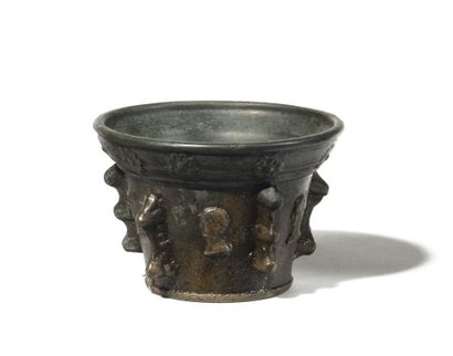 null BRONZE MORTAR
with five buttresses decorated with profiles of men, neck decorated...