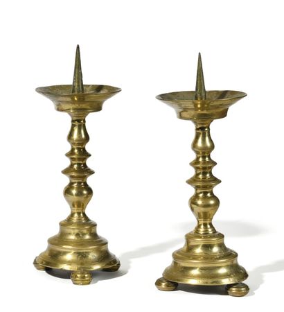 PAIR OF SMALL BRONZE CANDLESTICKS.
The baluster...