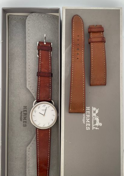 null HERMES
Arceau.
Circa 2010.
Steel bracelet watch, round case, signed white dial....
