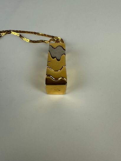 null WORK OF THE YEARS 1970
Modernist pendant in gold and silver plated metal totally...