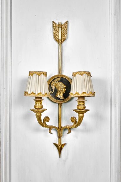 null Pair of gilded and chased bonze sconces with two moving light arms, the arrow...