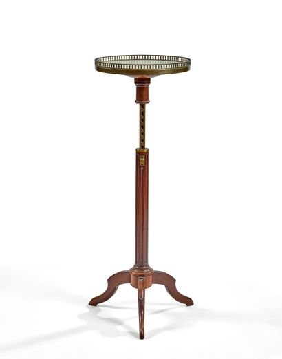 null MUET mahogany servery table with fluted shaft ending in a tripod base. The circular...
