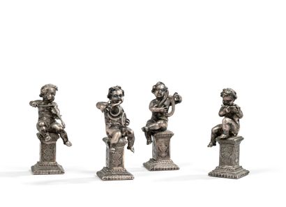 null FOUR silver PUTTI MUSICIANS seated on sheaths engraved with medallions. 



Marked...