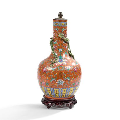 null CHINA, late 19th century

Famille rose porcelain and enamel bottle vase set...
