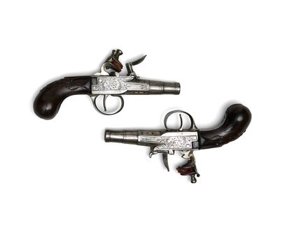 null Pair of flintlock pistols. 

Forced-fire round barrels with thunderbolts. 

Iron...