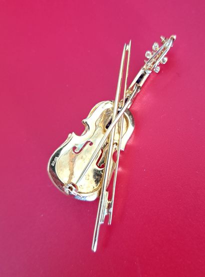 null BROCHE en or jaune 750 millièmes à décor d'un violon
Poids brut : 11.56 g
Long...