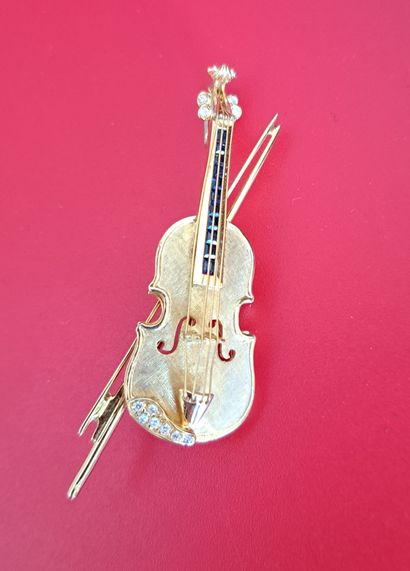 null BROCHE en or jaune 750 millièmes à décor d'un violon
Poids brut : 11.56 g
Long...