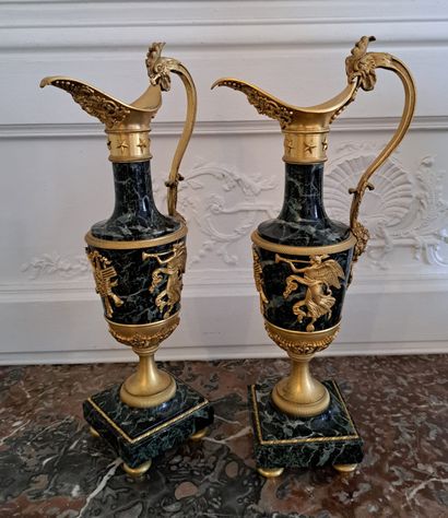  Claude GALLE (1759-1815) After
Pair of gilt bronze and patinated ewers with sea-green... Gazette Drouot