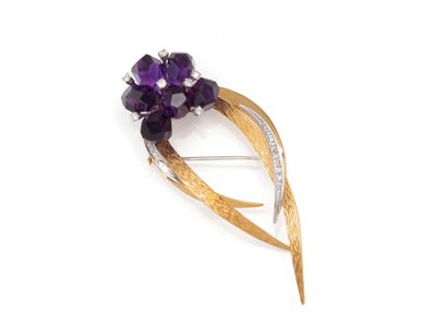 null BROCHURE 
featuring a plant-like design ending in an amethyst bouquet punctuated...