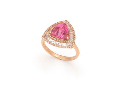 null RING 
holding in its center a rubellite of approx. 2.70 carats in a triple surround...