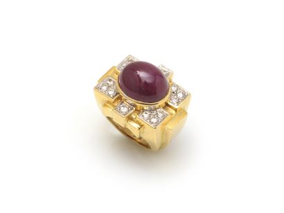 null RING 
holding a cabochon ruby weighing approx. 14 carats in a geometric setting...