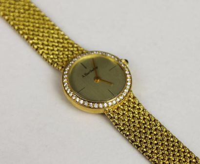 null MONTRE en or jaune cadran rond entourage diamants. Signée A.Barthelay. Poids...