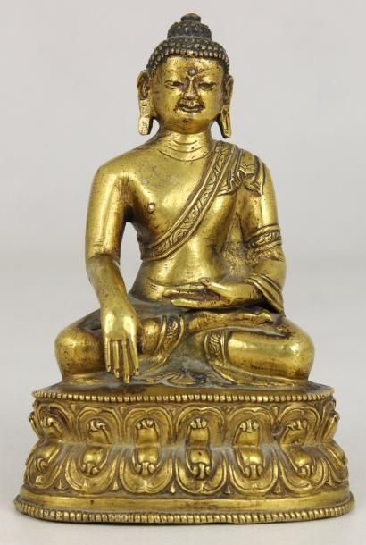 CHINE Bouddha en bronze doré en position assise. Fin XIXème siècle Haut : 15 cm