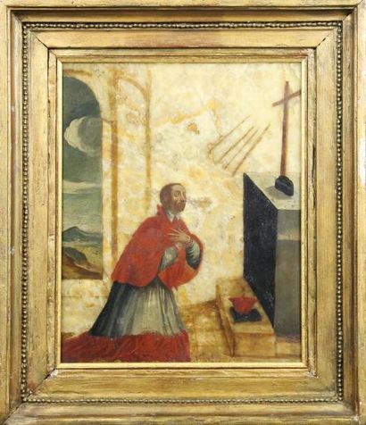 ECOLE ITALIENNE DU XVIIème SIECLE Saint Charles Borromée agenouillé devant un crucifix...