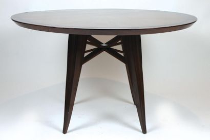 Maxime OLD (1910-1991) Rare table ronde en palissandre et placage de palissandre....