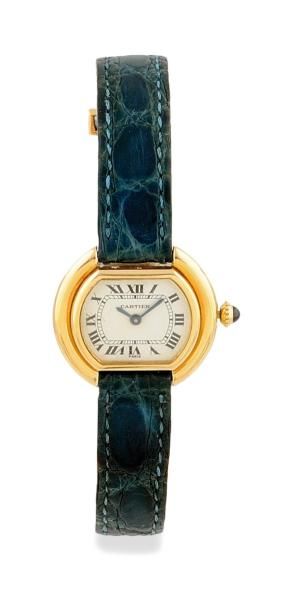 CARTIER Montre Une montre Cartier dame en or jaune sur cuir sur bracelet alligator....