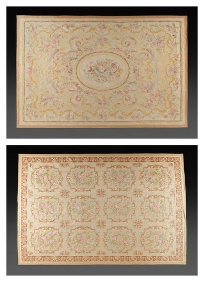 AUBUSSON XXème siècle Deux Tapis en laine polychrome à décor de rinceaux et volutes....