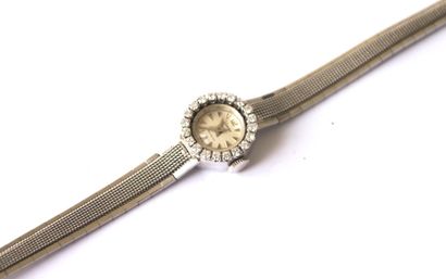 HERMA MONTRE en or gris, le bracelet rigide et articulé à maille ovale, cadran rond...