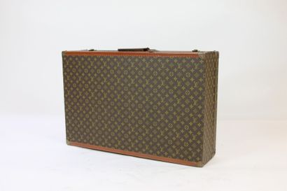 LOUIS VUITTON Grande VALISE rigide "Alzer" à compartiment intérieur en toile Monogram,...